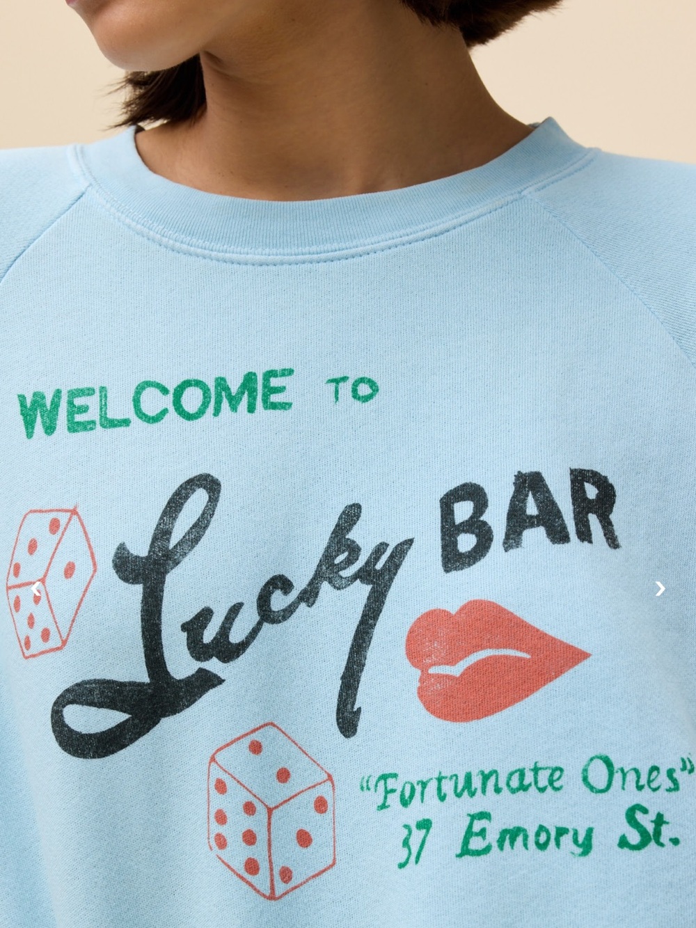 Daydreamer Light Blue Graphic 'Lucky Bar' cropped sweatshirt